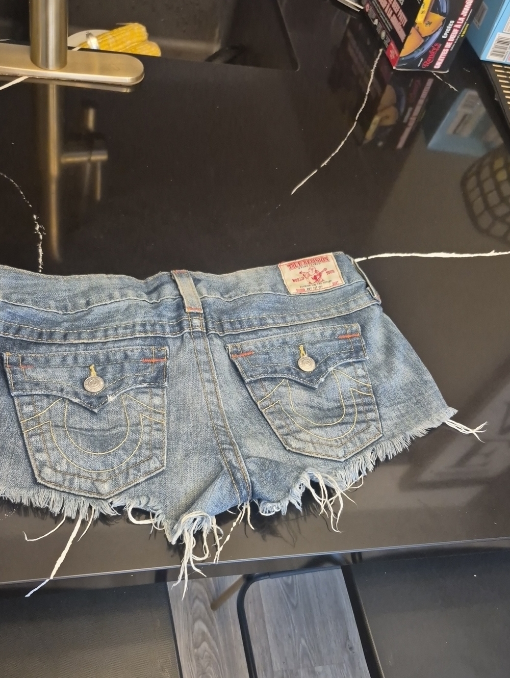 True Religion Distressed Light Blue Denim Cutoff Shorts